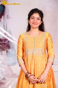 Actress Sai Pallavi in a yellow salwar kameez dress