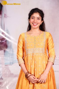 Actress Sai Pallavi in a yellow salwar kameez dress