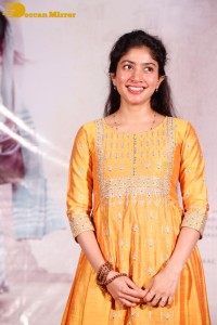Actress Sai Pallavi in a yellow salwar kameez dress