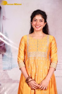 Actress Sai Pallavi in a yellow salwar kameez dress