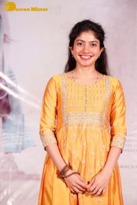 Actress Sai Pallavi in a yellow salwar kameez dress
