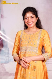 Actress Sai Pallavi in a yellow salwar kameez dress