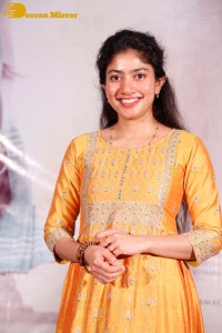 Actress Sai Pallavi in a yellow salwar kameez dress