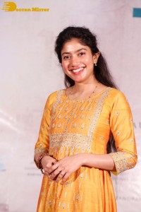Actress Sai Pallavi in a yellow salwar kameez dress