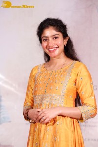 Actress Sai Pallavi in a yellow salwar kameez dress