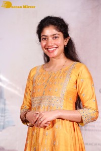 Actress Sai Pallavi in a yellow salwar kameez dress