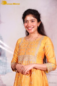 Actress Sai Pallavi in a yellow salwar kameez dress