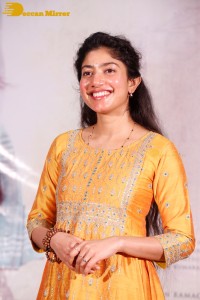 Actress Sai Pallavi in a yellow salwar kameez dress