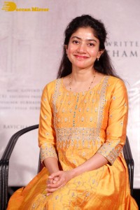 Actress Sai Pallavi in a yellow salwar kameez dress