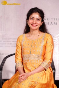 Actress Sai Pallavi in a yellow salwar kameez dress
