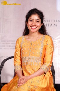 Actress Sai Pallavi in a yellow salwar kameez dress