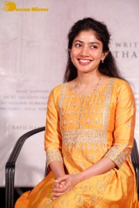 Actress Sai Pallavi in a yellow salwar kameez dress