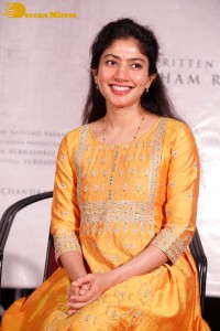 Actress Sai Pallavi in a yellow salwar kameez dress