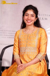 Actress Sai Pallavi in a yellow salwar kameez dress