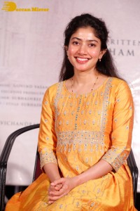 Actress Sai Pallavi in a yellow salwar kameez dress