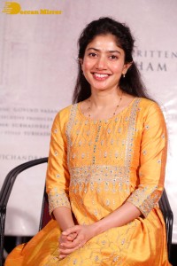 Actress Sai Pallavi in a yellow salwar kameez dress