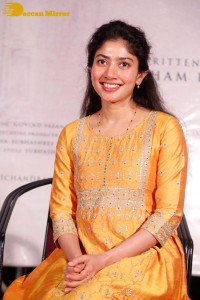 Actress Sai Pallavi in a yellow salwar kameez dress