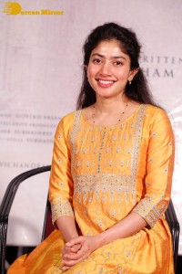 Actress Sai Pallavi in a yellow salwar kameez dress