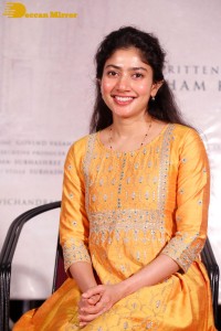 Actress Sai Pallavi in a yellow salwar kameez dress