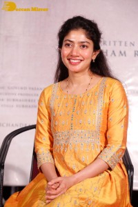 Actress Sai Pallavi in a yellow salwar kameez dress