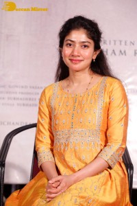 Actress Sai Pallavi in a yellow salwar kameez dress