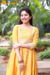 Actress Sai Pallavi in a yellow salwar kameez dress