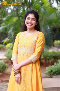 Actress Sai Pallavi in a yellow salwar kameez dress