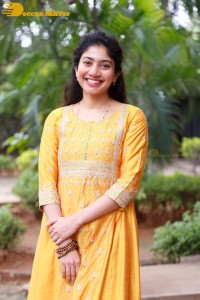 Actress Sai Pallavi in a yellow salwar kameez dress