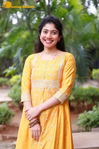 Actress Sai Pallavi in a yellow salwar kameez dress