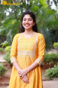 Actress Sai Pallavi in a yellow salwar kameez dress