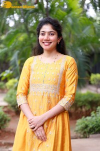 Actress Sai Pallavi in a yellow salwar kameez dress