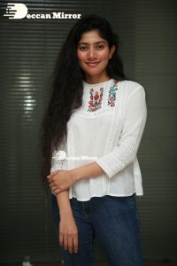 Actress Sai Pallavi in white top and blue jeans