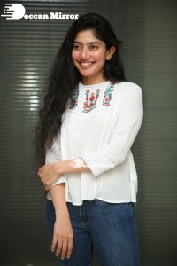 Actress Sai Pallavi in white top and blue jeans