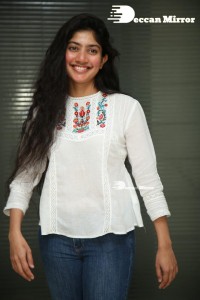 Actress Sai Pallavi in white top and blue jeans
