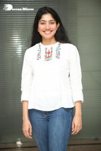 Actress Sai Pallavi in white top and blue jeans