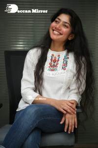 Actress Sai Pallavi in white top and blue jeans
