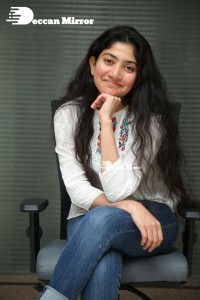 Actress Sai Pallavi in white top and blue jeans