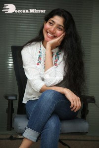 Actress Sai Pallavi in white top and blue jeans