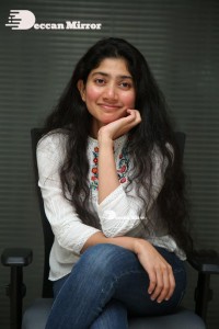 Actress Sai Pallavi in white top and blue jeans