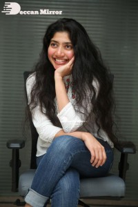 Actress Sai Pallavi in white top and blue jeans