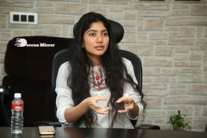 Actress Sai Pallavi in white top and blue jeans