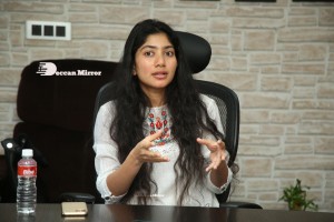 Actress Sai Pallavi in white top and blue jeans
