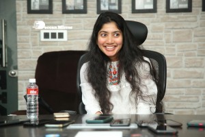 Actress Sai Pallavi in white top and blue jeans