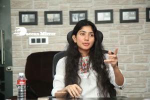 Actress Sai Pallavi in white top and blue jeans