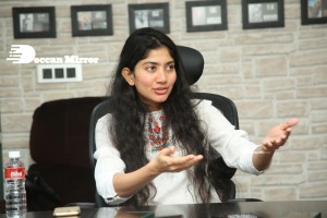 Actress Sai Pallavi in white top and blue jeans