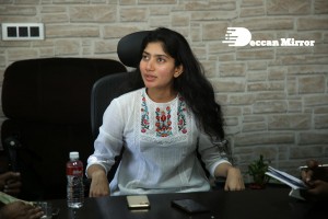 Actress Sai Pallavi in white top and blue jeans