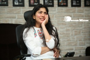 Actress Sai Pallavi in white top and blue jeans