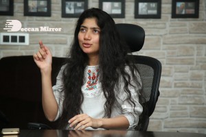 Actress Sai Pallavi in white top and blue jeans