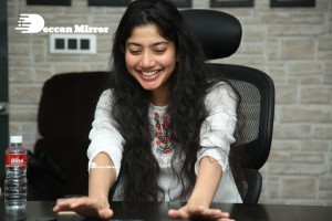 Actress Sai Pallavi in white top and blue jeans