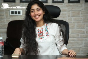 Actress Sai Pallavi in white top and blue jeans